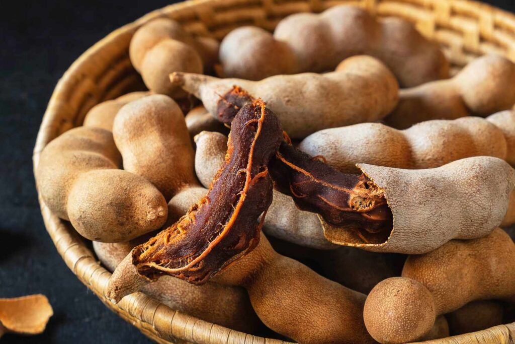 Bowl filled with homemade tamarind chutney, a tangy and flavorful condiment.