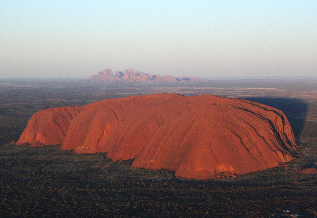 Kata Tjuta's domed rock formations standing tall against a backdrop of desert landscape.
